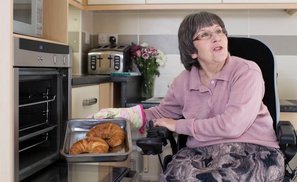 Tenant in adapted kitchen
