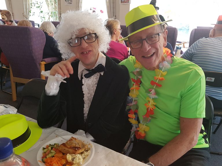 Tenants enjoying Purim meal --Francis & Dick James Court