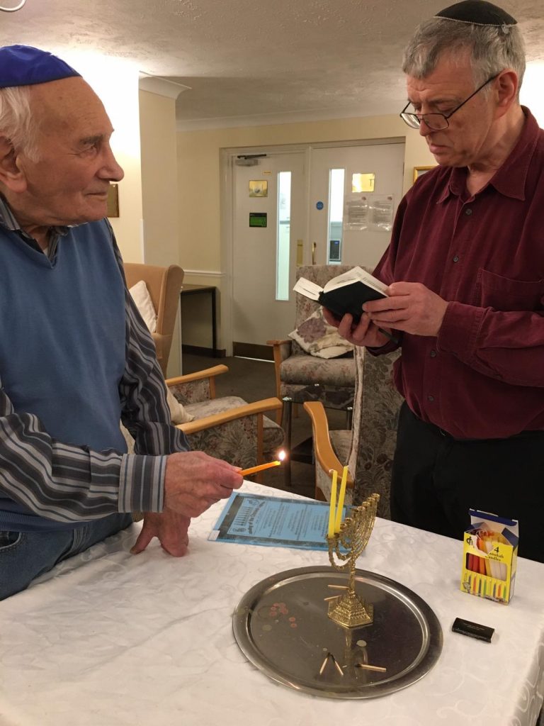 Lighting Chanukah candles --Hilary Dennis Court