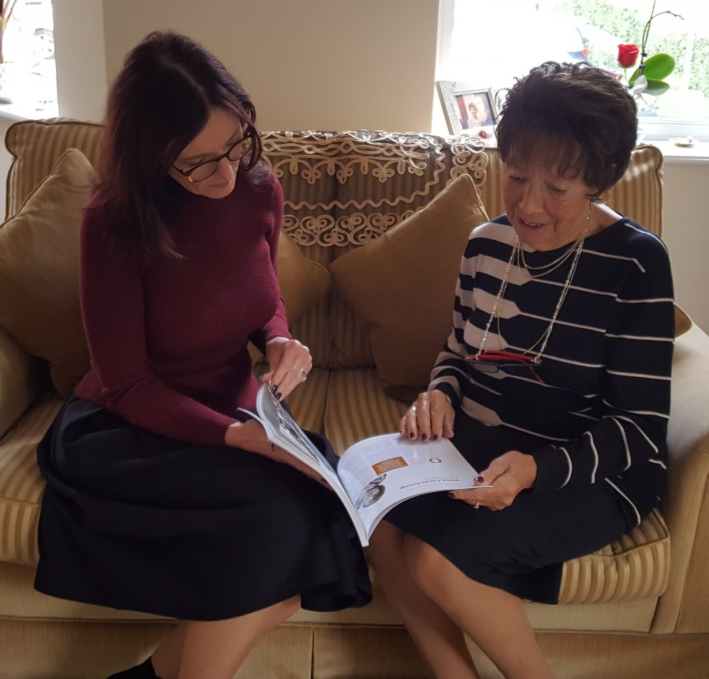 Member of Tenancy Support Team with prospective tenant looking at paperwork